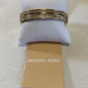 Michael Kors Gold Plated Bangle with baguettes and round crystals.